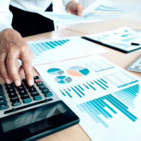 Finances Saving Economy concept. Female accountant or banker use calculator.